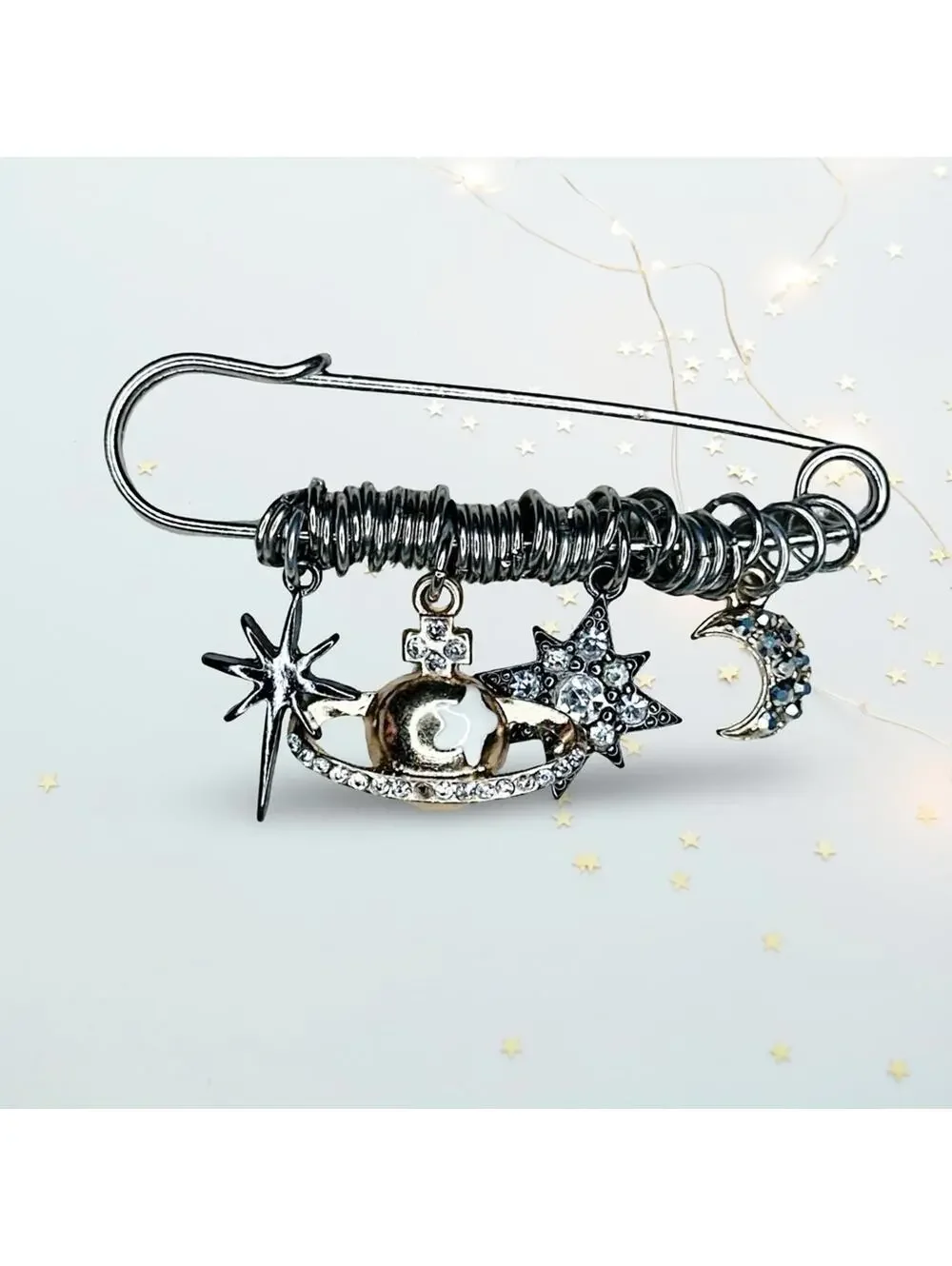 244. Silvertone Celestial Charm Brooch